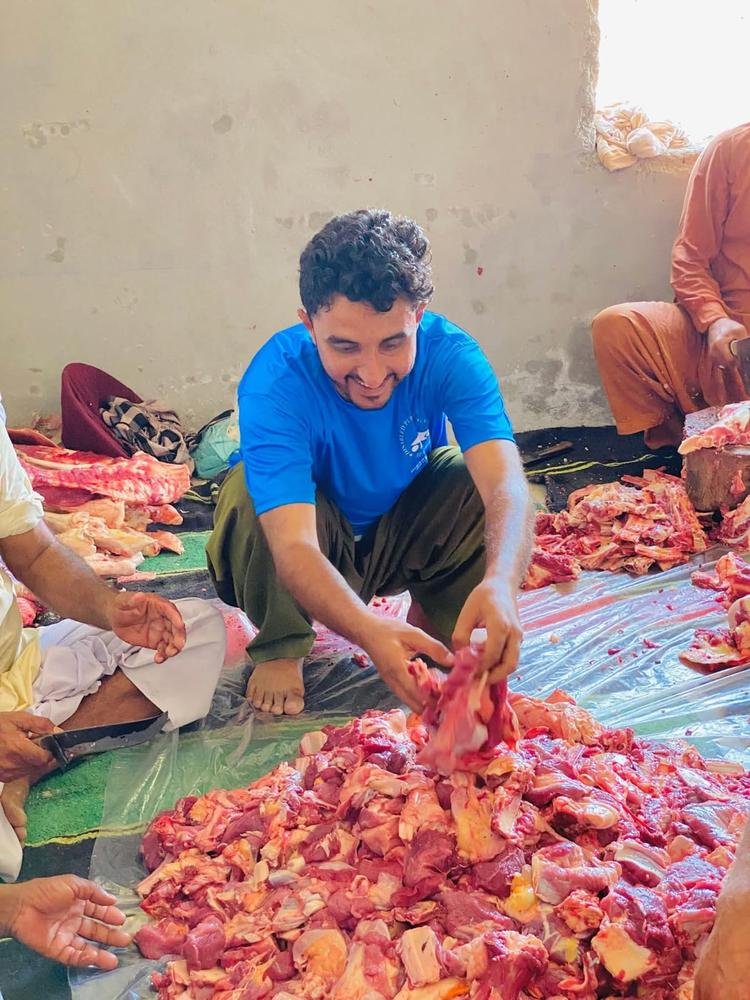 DPO volunteer preparing Qurbani meat for distribution
