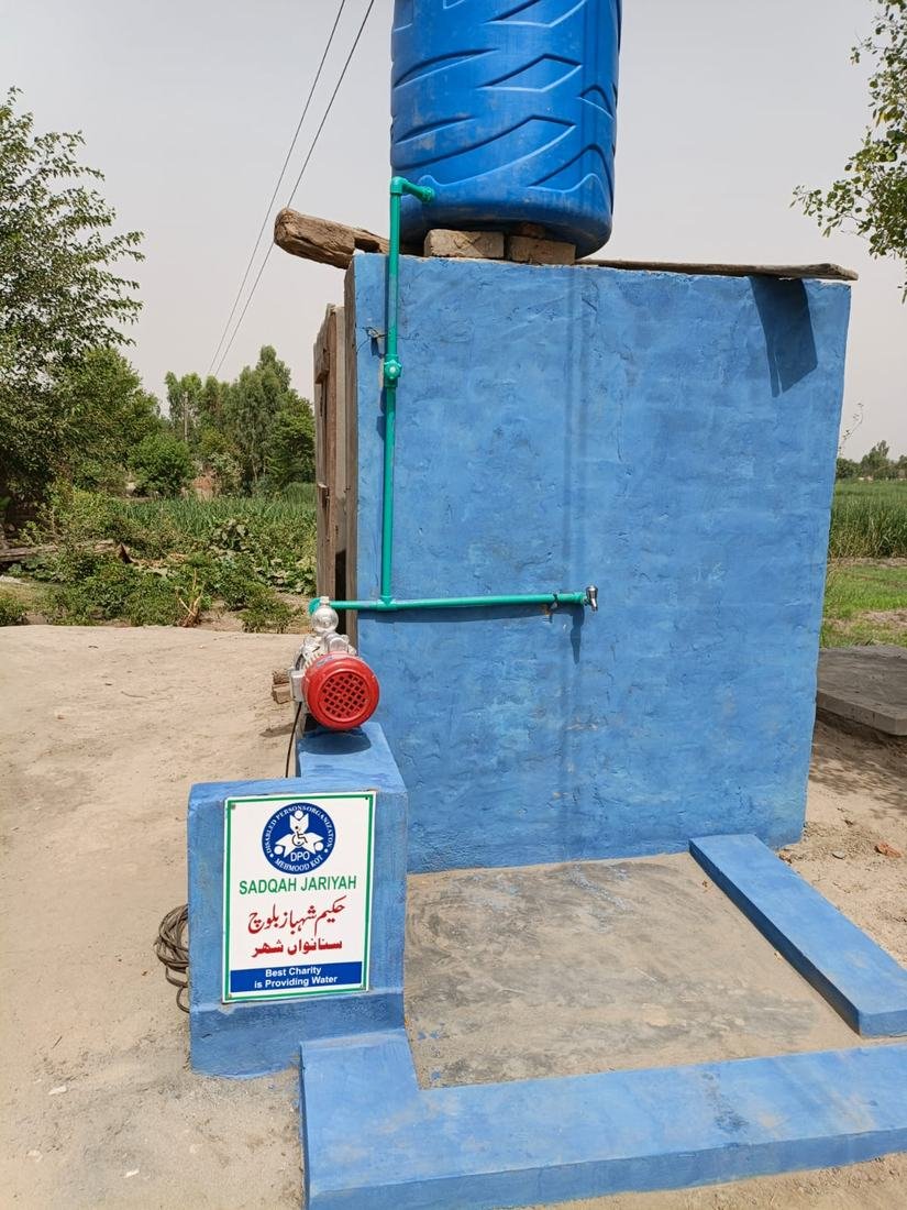 Sadqah Jariyah motor water pump with donor plaque installed by DPO